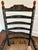 Beautifully detailed stenciled rocking chair with ladder back and rush seat. Black with mostly red, sage green, cream...