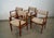 Set of four Mid century Danish Modern dining arm chairs for sale. These are made of solid teak, and were previously...
