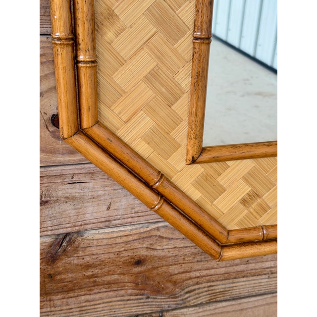 A beautiful vintage octagonal wall mirror featuring a bamboo frame surrounding a finely woven rattan matting panel. Double...