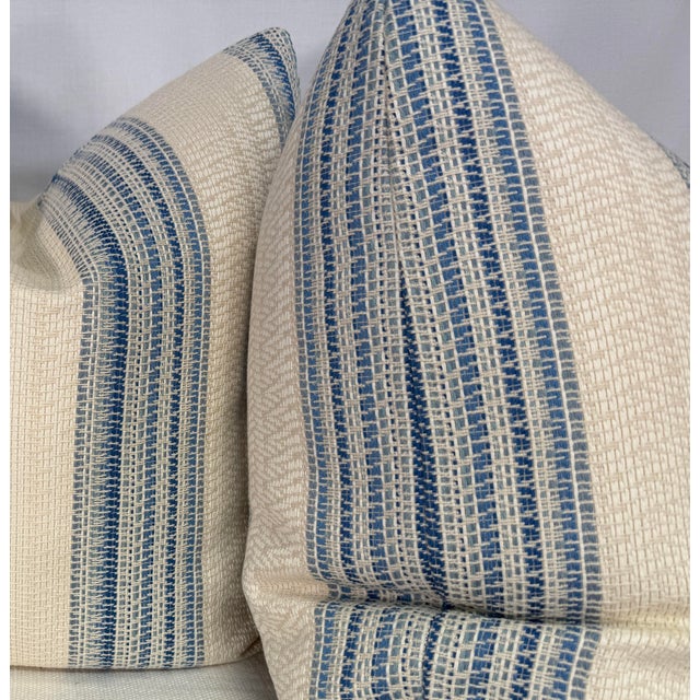 Custom pair of 22" pillows covered in Schumacher "Bendita Stripe" in color blue indoor/outdoor fabric. These pillows have...