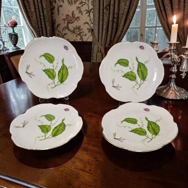 The Vintage Set of 4 Dessert Plates from the Jardin Collection by I. Godinger features a charming design of ladybugs,...