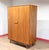 A beautiful mid century armoire made by renowned British furniture maker G Plan as part of their Danish range and designed...