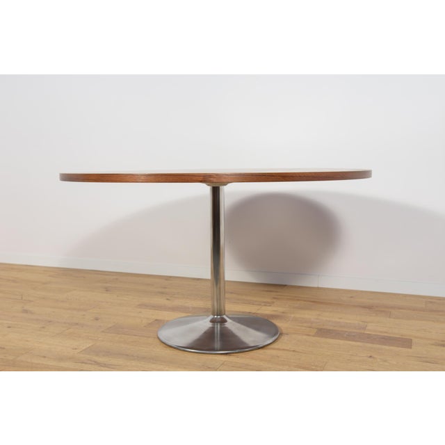 The table was produced in Denmark in the 1970s. Table top made of jatobe veneer. The furniture is after a comprehensive...