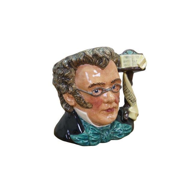 Large vintage Royal Doulton 7056 porcelain character jug of Franz Schubert featuring the composer in a black coat with...