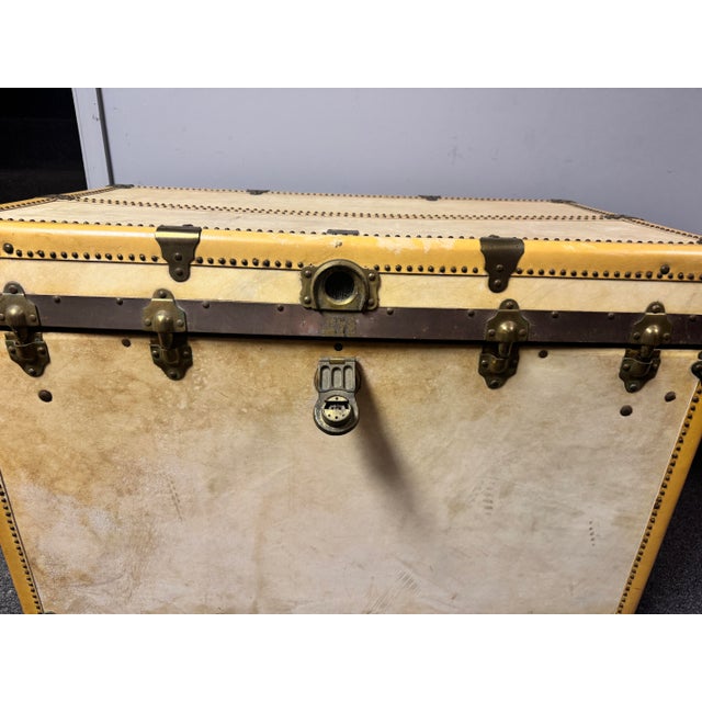 An early 20th century wardrobe trunk by Oshkosh Trunks & Luggage Co., Oshkosh, Wisconsin, retaining its original interior...