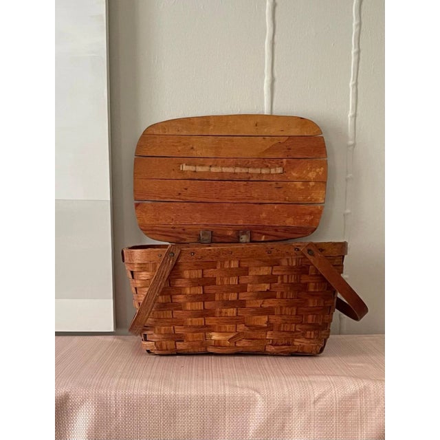 Vintage woven picnic basket with solid lid on hinge and handles This basket is a classic shape and texture and would be a...