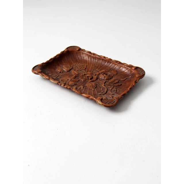 This vintage 1940s Syroco style tray features a cast composite wood design with gracefully curved ends and an ornate...