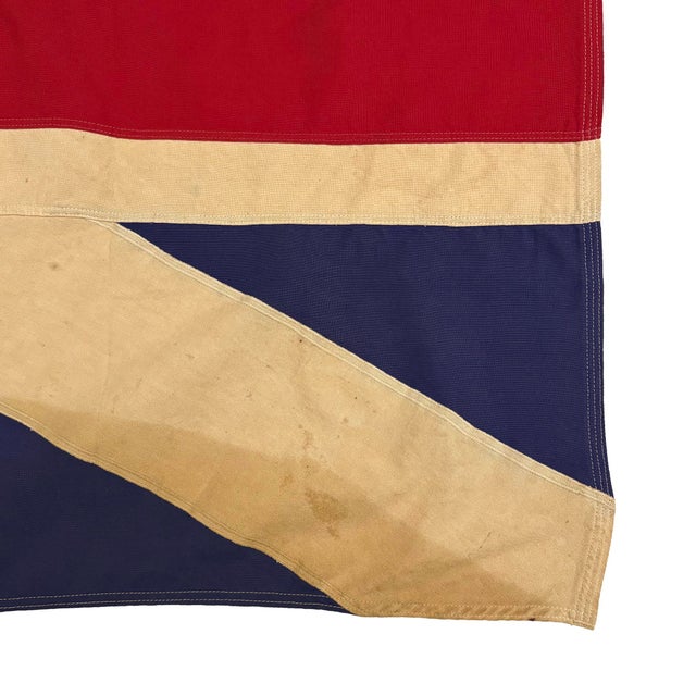 This vintage Union Jack flag represents the pre-1800s design preceding the addition of St. Patrick's Cross. Made from a...