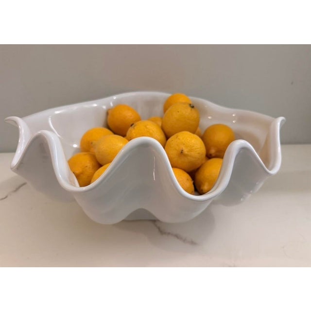 A very rare Midcentury Clamshell porcelain Punch bowl with ladle. A great centerpiece when not in use. Looks like it never...