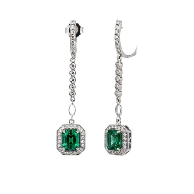 Introducing our exquisite handmade earrings crafted in New York City: the Emerald Shaped Emeralds Halo Diamond Lariat...