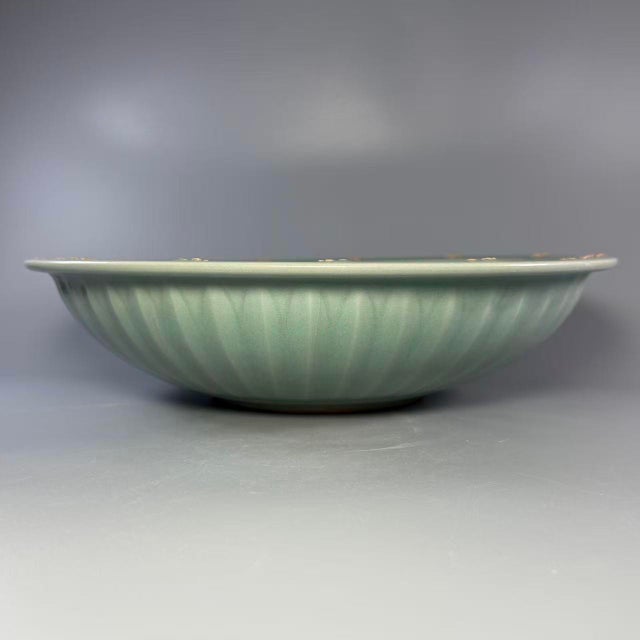 This vintage Longquan celadon shallow‑sided plate features beautiful crackled turquoise‑green glaze. A raised‑relief...