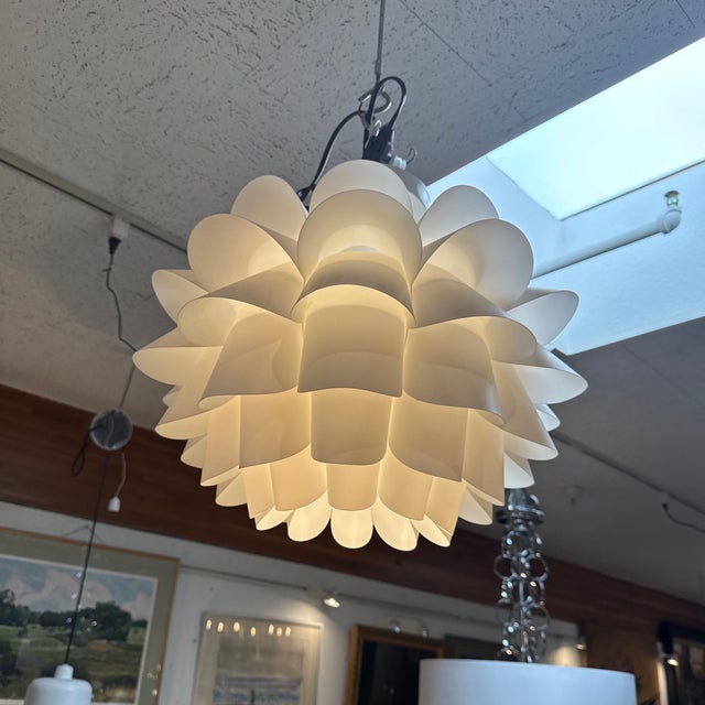 Design Plus Gallery presents the White Flower Pendant from Possini Euro. This is a mid-century modern-inspired fixture...