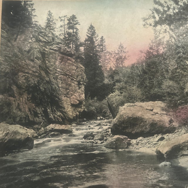Circa 1900-15; photograph is of Colorado in the Rocky Mountains; print is attached at top to board; measures 9.75”x8”.