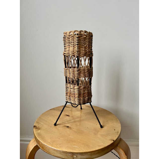 French table lamp c.1960 rattan shade on metal tripod base. rewired with vintage style twisted fabric covered cable....