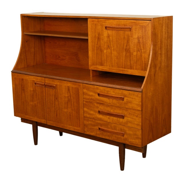 A very stylish original Mid Century Modern teak credenza bar, by G Plan, 1960s. This very chic twin level credenza is made...