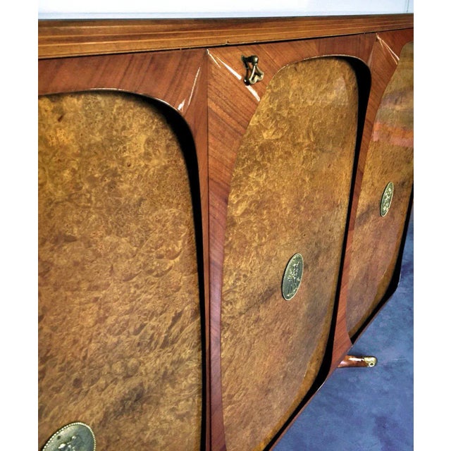 Rare sideboard three-doors designed by Vittorio Dassi in the 1950s. It's a very fine item made using precious materials as...