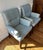 This pair of mahogany frame arm chairs exhibits the flair of mid century modern design as reinterpreted by Thom Filicia...
