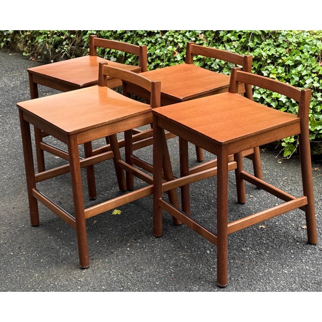 Sleek set of 4 Italian made stools. These stools feature a minimalist, low-back design with clean lines, typical of mid-...