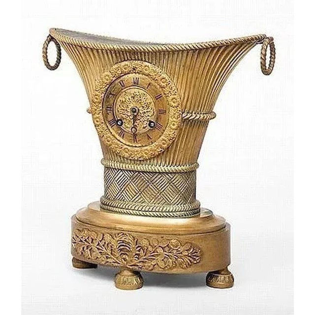 Antique French Empire gilt bronze 'flower vase' mantle clock from the Charles X period 1825. With 3 inch gilt dial and...