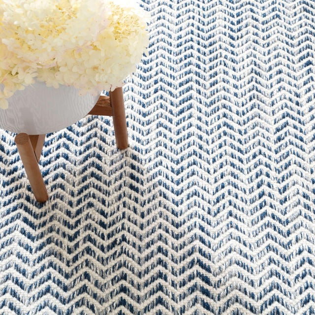 Styled for ship or shore, and open-air living, this rug is handwoven in sun-, rain-, dog- and child-proof performance...