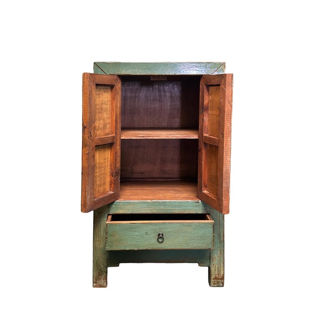 This elegant Chinese-style cabinet features a striking distressed teal lacquer finish that allows the warm, natural wood...