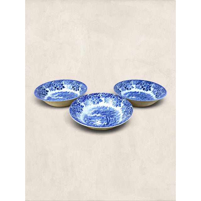 A charming set of three vintage blue and white transferware bowls by Churchill England, dating to circa 1997. Each bowl...