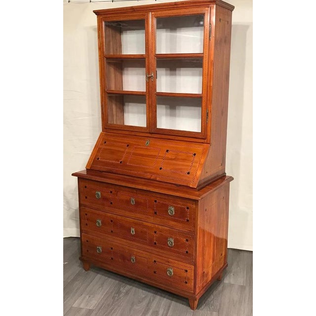 Louis XVI secretary bookcase, South German 1780. Elegant and unique secretary bookcase with beautiful cherry veneer and...