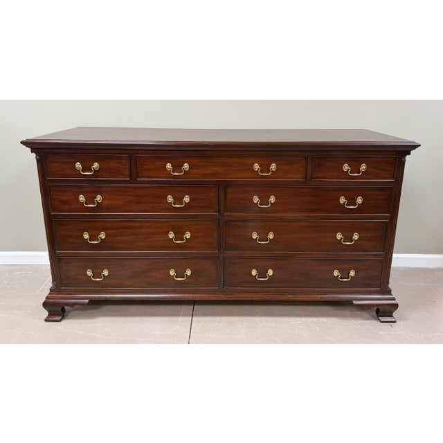 This Henkel Harris Mahogany Dresser Model No. 166 reflects the exceptional quality and timeless traditional style that...