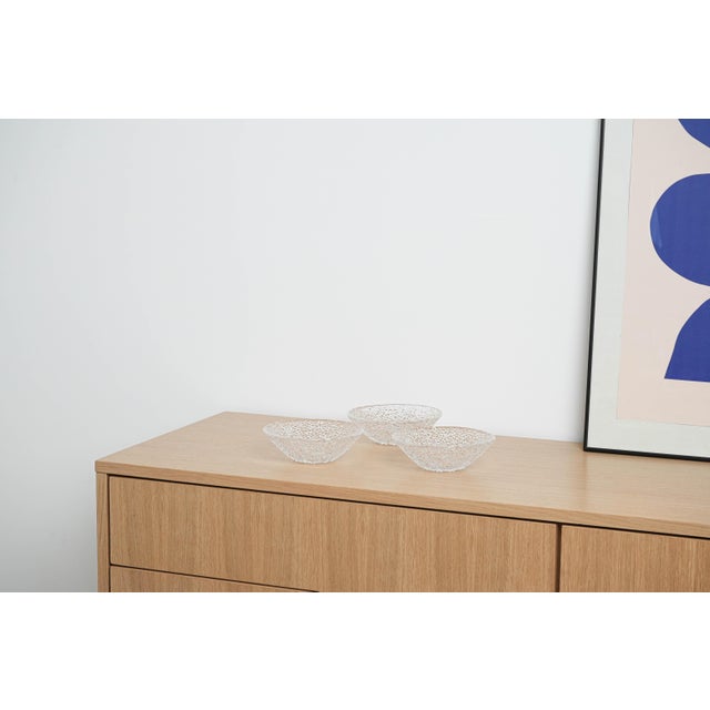 The set of bowls was made in the 1970s in Italy. Three glass bowls with a decorative texture resembling cracked ice - ice...