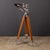 A pair of second world war anti-aircraft binoculars, mounted on their original wooden and polished metal tripod. The...