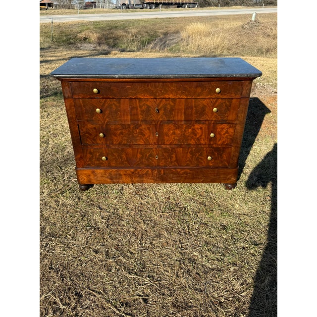 19th Century French Louis Philippe Commode from nice France. Made of Flam Mahogany, with a Black marble top, the wood has...