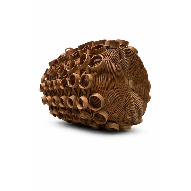 This vintage round basket is finely handwoven from natural wood splints, featuring a classic cylindrical form and a...