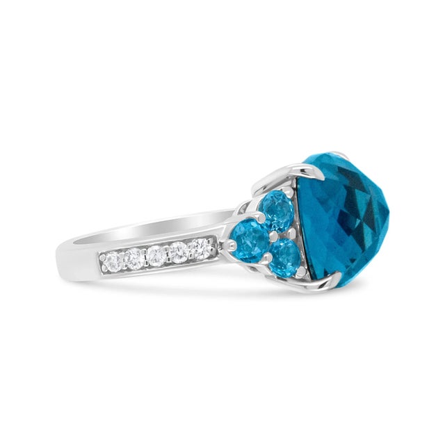Contemporary 18K White Gold 10mm Cushion Shaped Blue Topaz and 1/6 Cttw Diamond 3 Stone Style Ring (F-G Color, VS1-VS2 Clarity) - Ring - Size 6.5 For Sale - Image 3 of 6