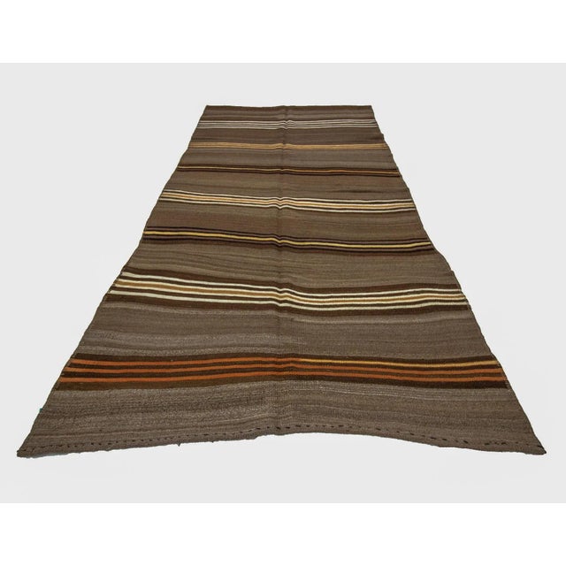 Vintage handwoven wool kilim rug from Kars region of Turkey. Approximately 50-60 years old. In very good condition