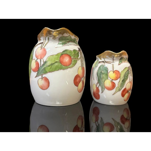 A pair of Tressmans & Vogt hand painted porcelain creamers. Each is backstamped to the underside with the T&V mark...