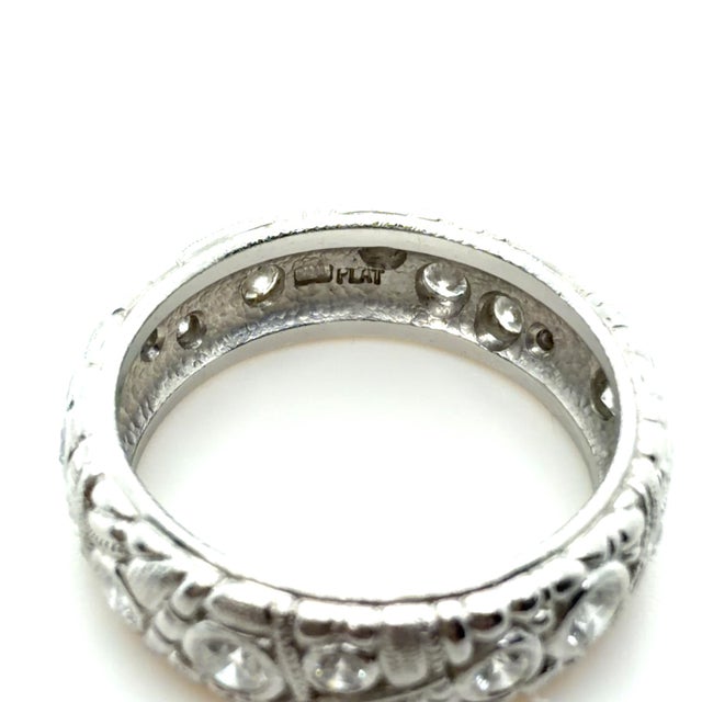 A distinctive creation by Alex Sepkus, this whimsical 18K gold ring showcases 18 round brilliant-cut diamonds totaling...
