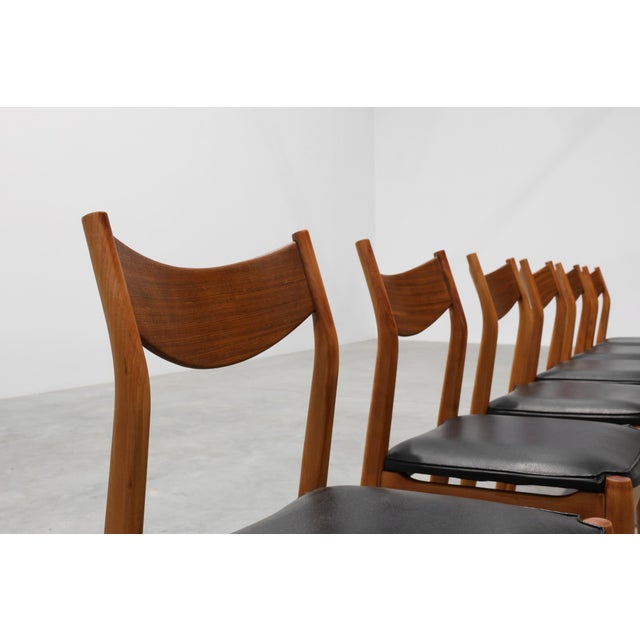 Belgium / 1960 / 6 dining chairs / teak and faux leather / Mid-century / vintage A striking ensemble of six vintage dining...