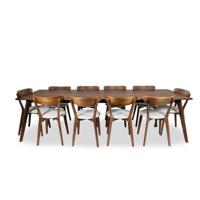 Large dining room set accompanied by its 10 chairs, Italian style, in walnut. 21th century work. This piece is designed in...