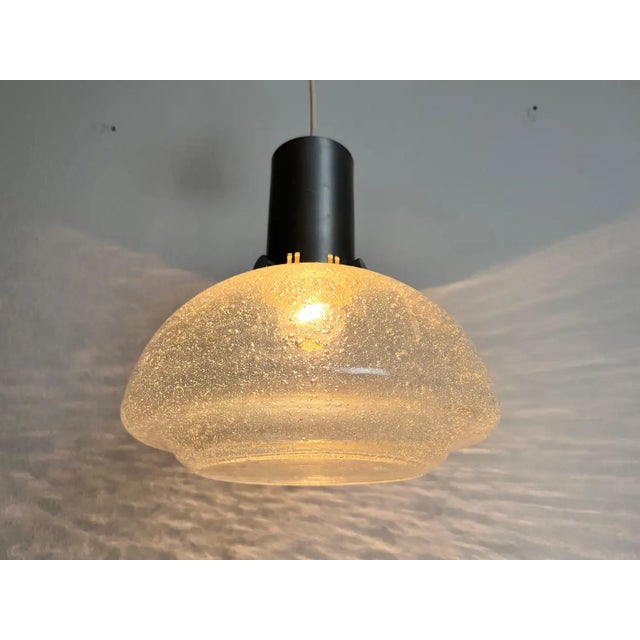 A Doria ice glass pendant lamp made in Germany in the 1960s. It is fascinating with its rare glass shape. Measurements:...