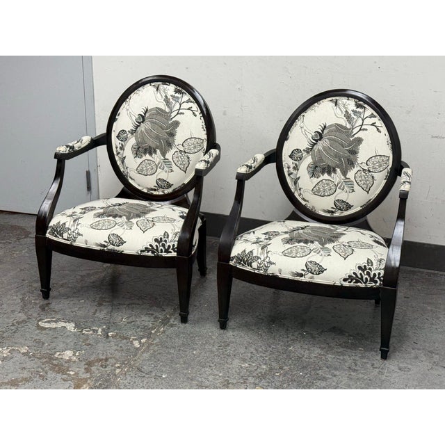 Design Plus Gallery presents a Pair of Truro Upholstered Oval Back Armchairs from Kravet Furniture. This elegant pair has...