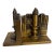 Vintage Brass Bookends Depicting a City Scape and Torch - A Pair For Sale
