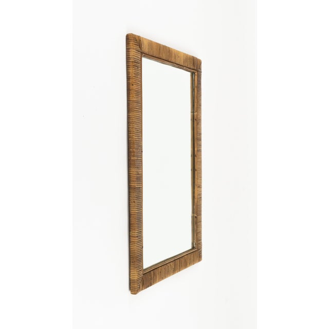 Midcentury beautiful rectangular wall mirror in rattan in the style of Vivai Del Sud. Made in Italy in the 1970s. Vivai...