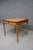 Theodore Alexander walnut game table featuring a square checkerboard playing surface in red and golden yellow, framed by...