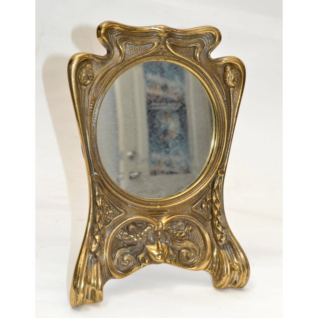 Art Nouveau Whimsical handcrafted Cast Bronze Table or Vanity Mirror. Mirror size: 5.25 inches diameter.