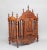 This early 19th-century French fruitwood food cupboard features a carved and shaped top decorated with turned finials. The...