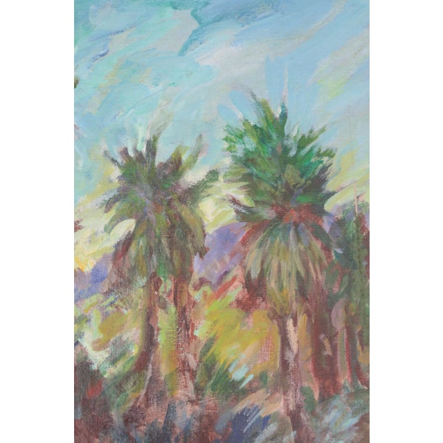 Beautiful land and seascape with rich saturated colors. Unsigned. Displayed in a painted silver and baby blue wood frame.