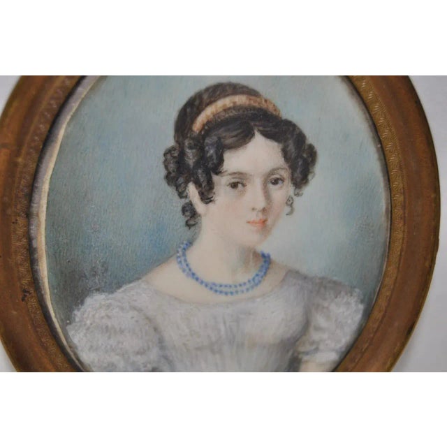 A splendid mid 19th century portrait miniature of a beautiful young lady. The miniature has no visible signature, and...