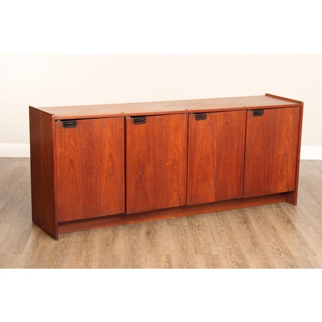 High Quality Danish Made Teak Sideboard Manufactured By Randers Mobelfabrik. Features Four Cleanly Integrated Cabinet...