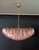 Elegant italian pendant light made from 185 pink murano glasses "poliedri". Structure in gold and brass colored metal....