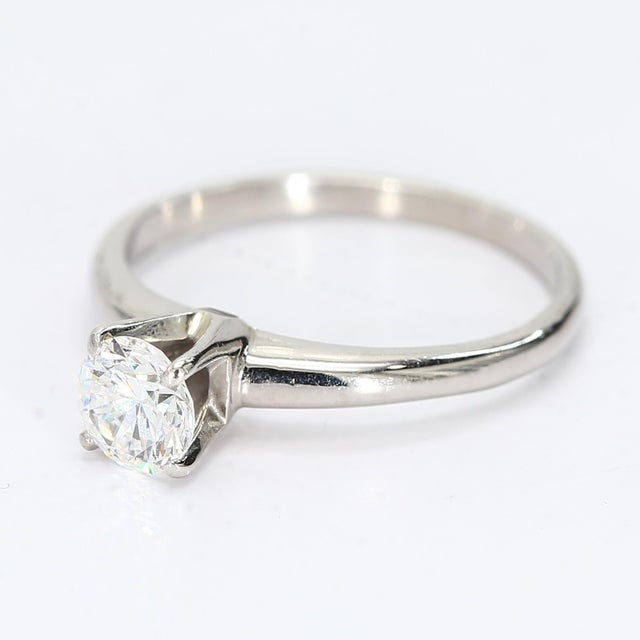 This is a gorgeous 18k white gold solitaire ring, sized 5.25. It has a 0.5ct natural diamond graded at VVS1/E - Stone Info...